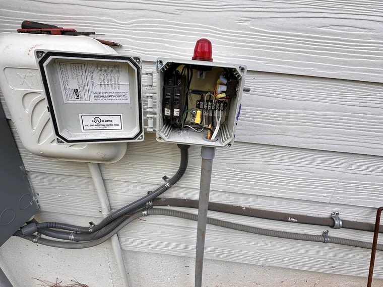 Septic pump control and alarm panel opened for service by SepticRooter™ in Savannah & the SC Low Country, Georgia